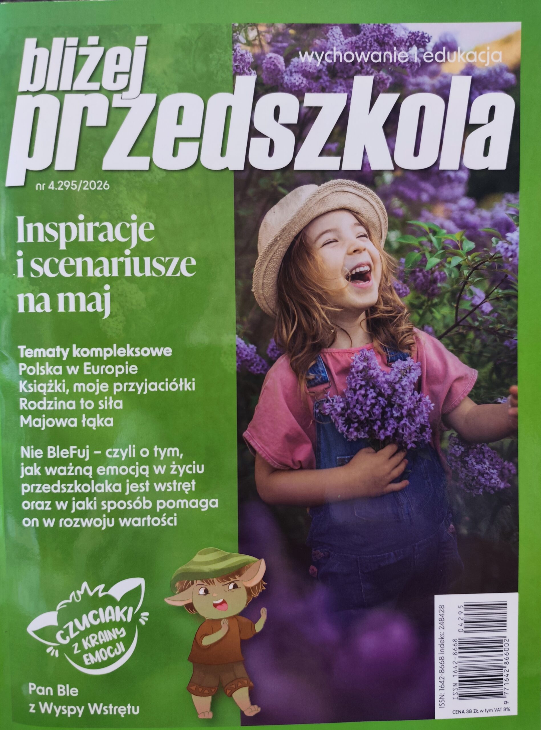 Okładka magazynu z dziewczynką trzymająca kwitnącą gałązkę lilaka pospolitego w kolorze ciemo-fioletowym. Dziewczynka śmieje się.